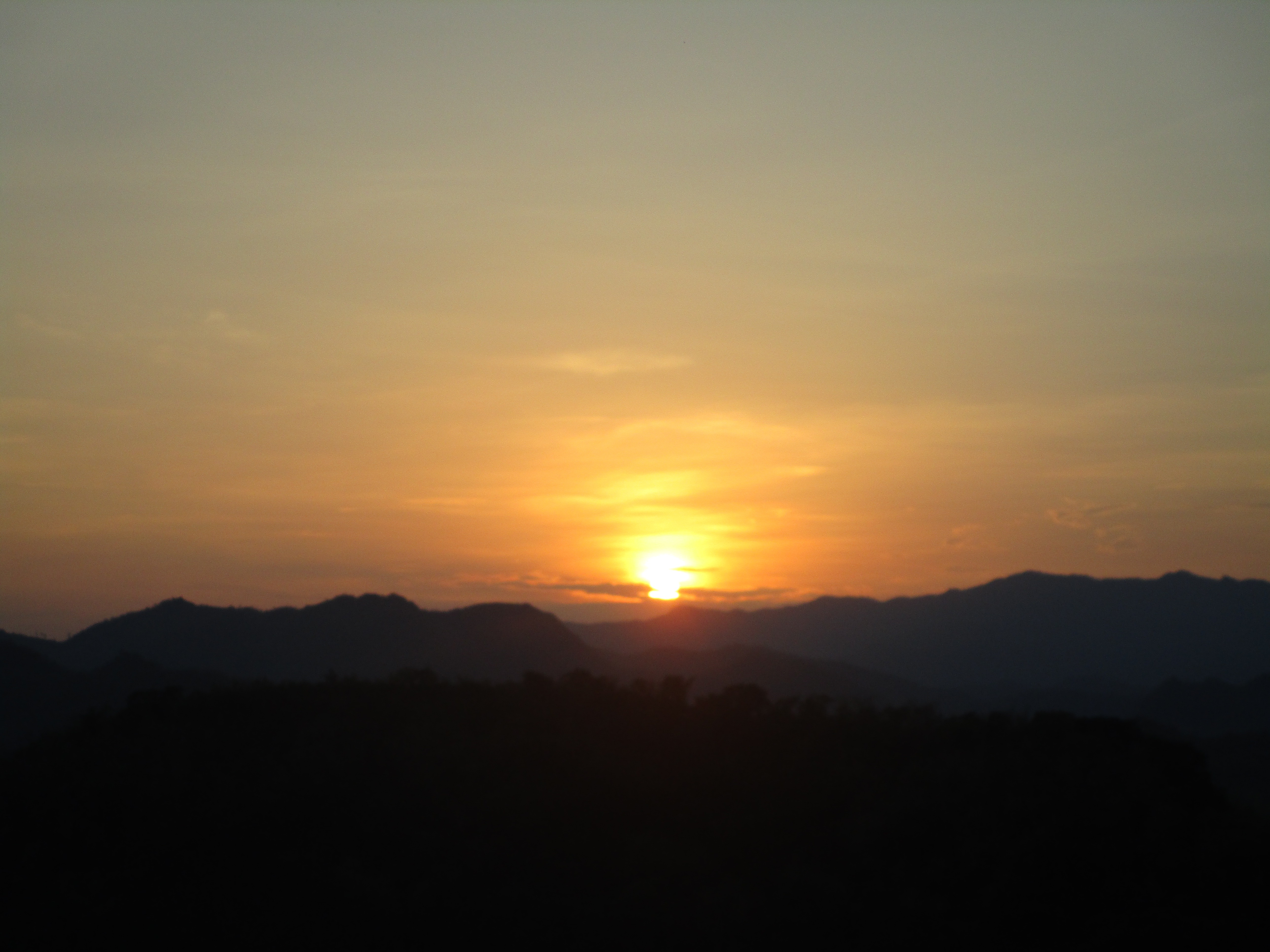 Golden sunset over the moutains of Laos